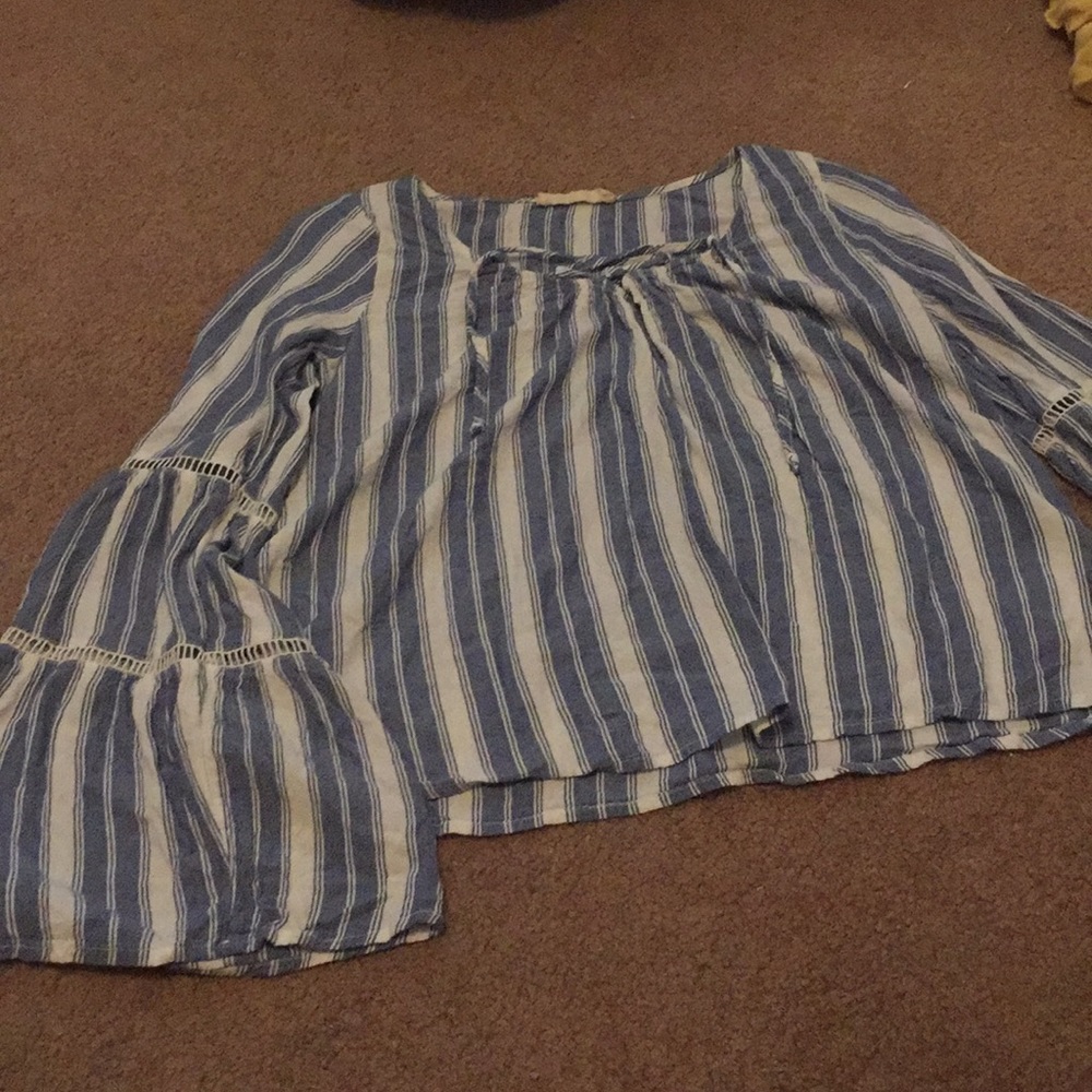 A long flared sleeve summer shirt